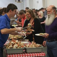 Kings County Supervisor Joe Neves gets a good helping of crab at the annual Rotary Crab Feed.